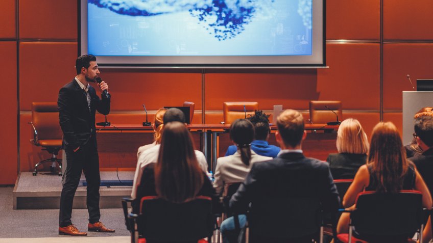 Public speaker at science convention.