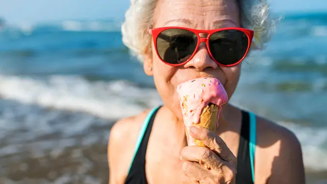 Senior woman eating an ice-cream.