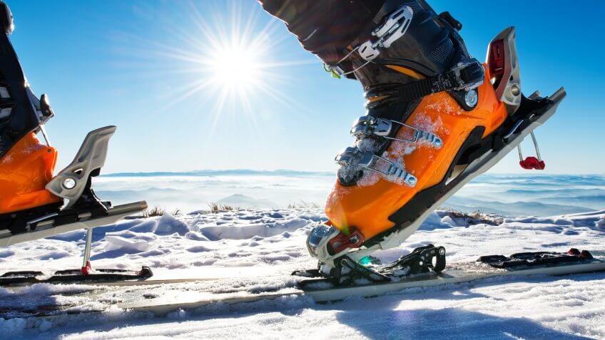 Close up shot of ski boot on the snow.