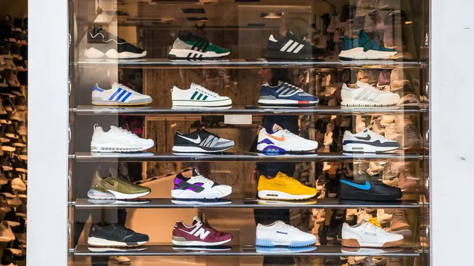 London, UK - 21 March, 2018: retail display of trendy sneakers displayed in the window of a shoe shop in central London, UK.