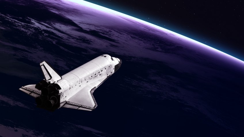 space shuttle over Earth