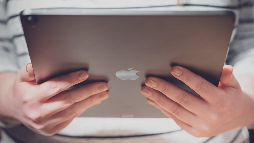 woman looking at iPad Pro