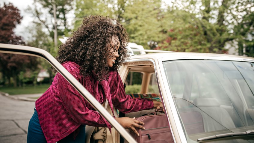 Woman in the car.