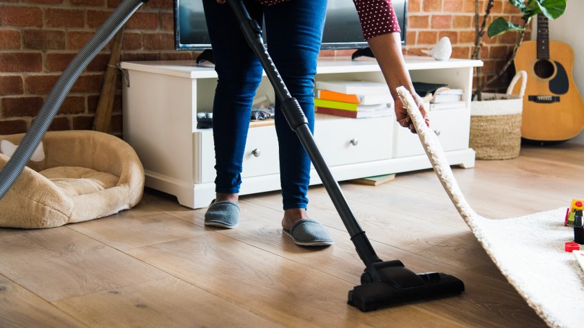 woman is cleaning room.