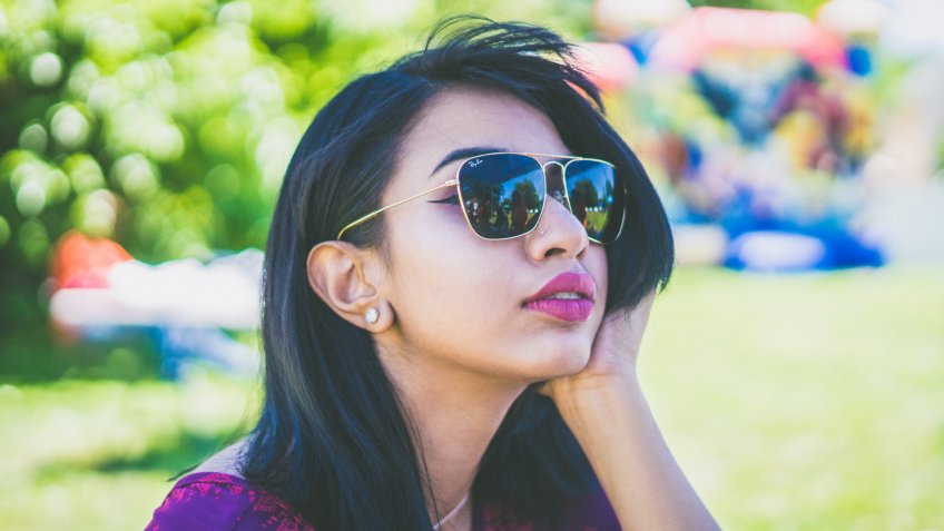 woman wearing Ray Ban sunglasses