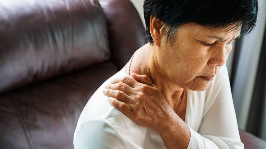 neck and shoulder pain, old woman suffering from neck and shoulder injury, health problem concept.