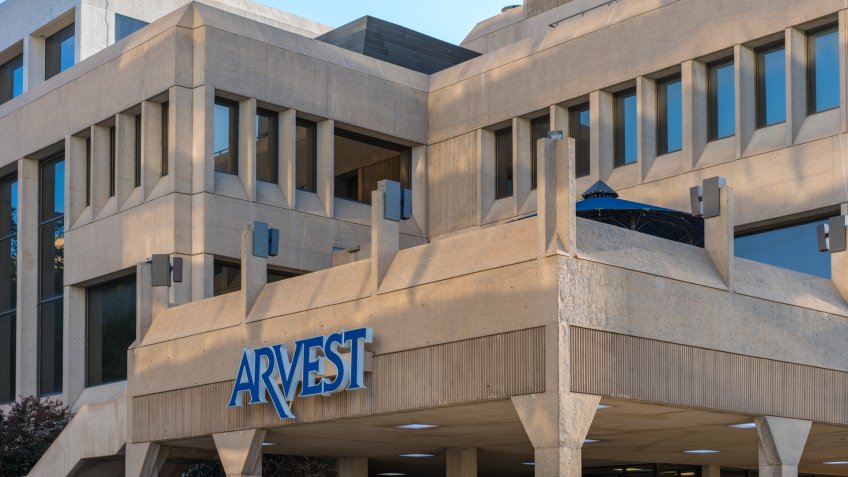 Fayetteville, Arkansas / USA - May 04 2019: Arvest Bank building downtown Fayetteville, Northwest Arkansas, Arkest blue sign - Image.