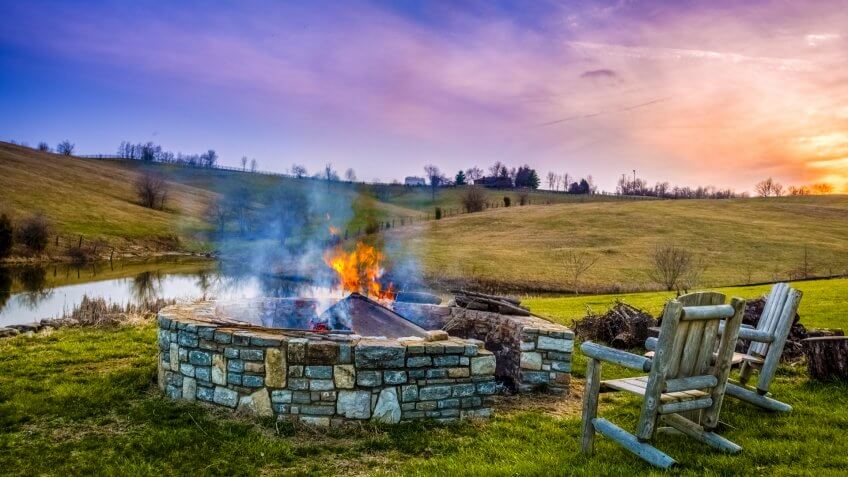 Bonfire in a fire pit at sunset in Central Kentucky countryside - Image.