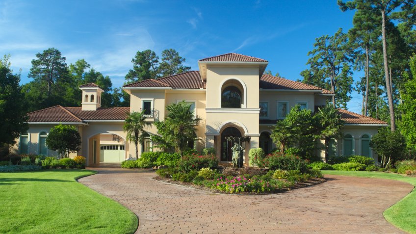 Luxury home exterior under early morning light.