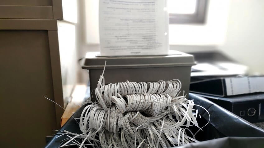 Destroying documents with Document shredder machine - Image.