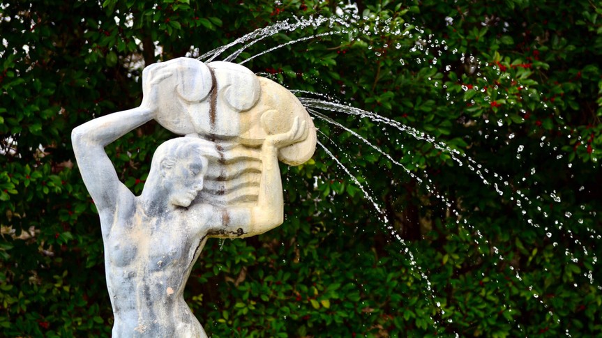 NEW ORLEANS, LOUISIANA-JANUARY 13: A water fountain statue of a male God Aquarius, the water bearer, on display in the Art and Sculpture Garden in New Orleans City Park on January 13, 2017.
