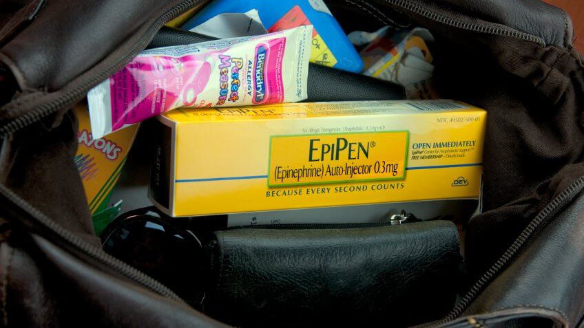 "Weybridge, England-March 8, 2011: An open purse showing the contents.