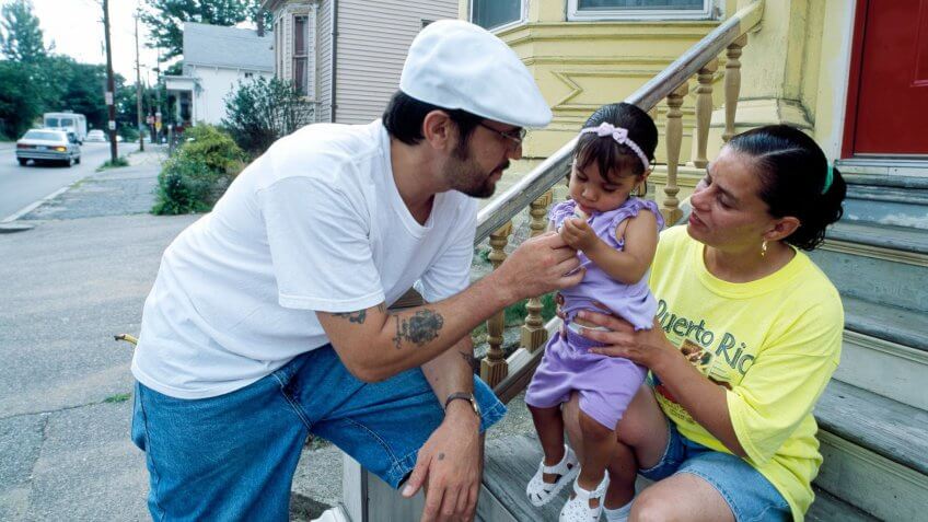 Family on stoop in Boston Massachusetts in 1980s