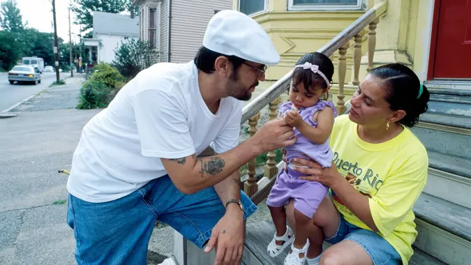 Family on stoop in Boston Massachusetts in 1980s