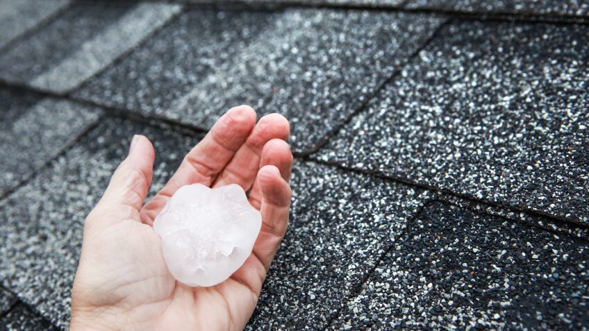 Hail in hand on a rooftop after hailstorm - Image.
