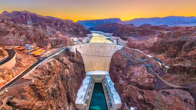 Hooover Dam on the Colorado River straddling Nevada and Arizona at dawn.
