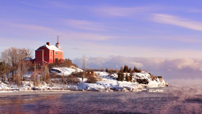 The historic Marquette Harbor Lighthouse on Lake Superior, Michigan's Upper Peninsula in winter.