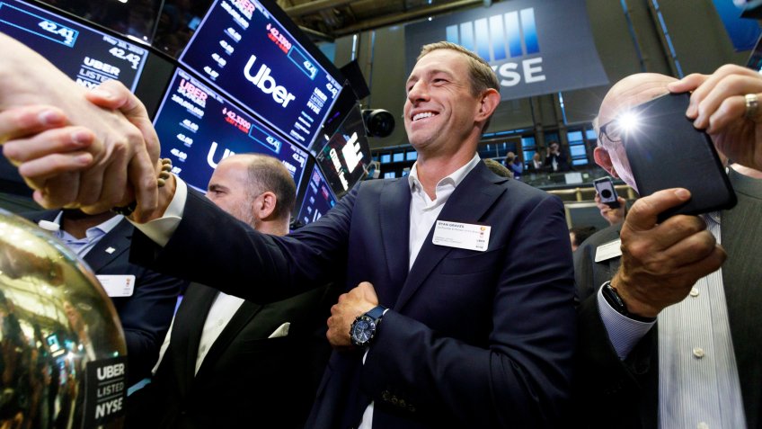 Mandatory Credit: Photo by JUSTIN LANE/EPA-EFE/Shutterstock (10233953ae)Ryan Graves (C), one of the co-founders of Uber, celebrates today's initial public offering for Uber at the New York Stock Exchange in New York, New York, USA, 10 May 2019.