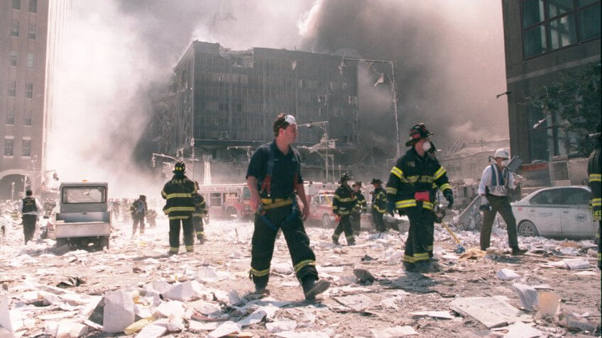 NEW YORK - SEPTEMBER 11: New York City firefighters work near the area known as Ground Zero after the collapse of the Twin Towers September 11, 2001 in New York City.