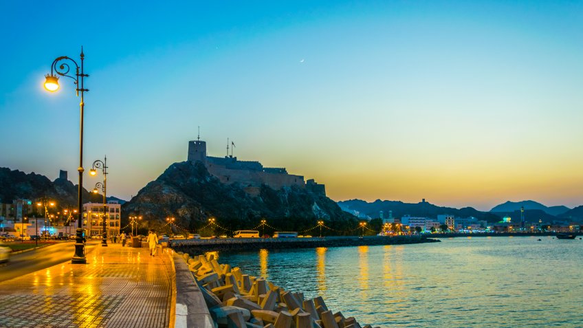 View of a fort in Muttrah district of Muscat during sunset, Oman.