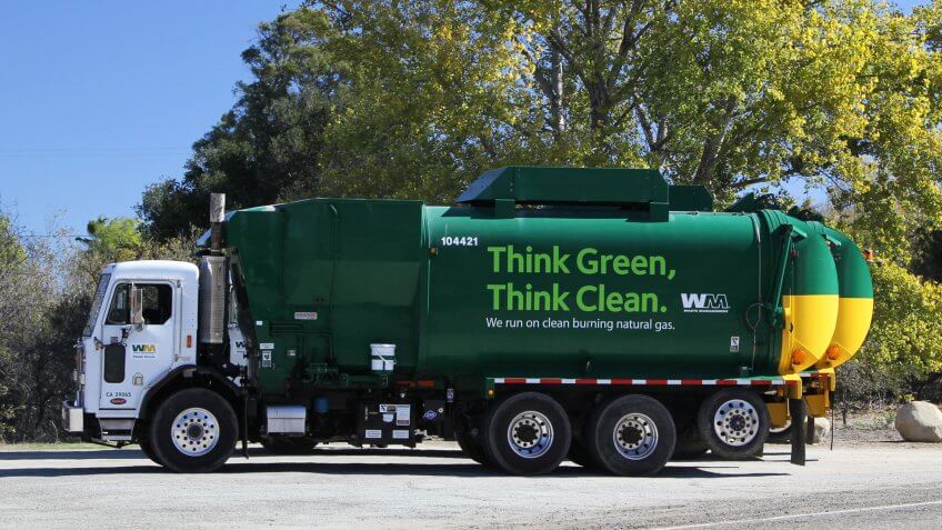 California, USA, Nov 16, 2015: Green vacuum truck near a tree - Image.