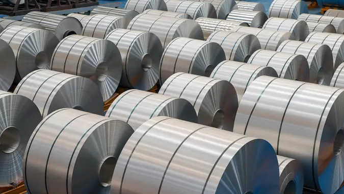 Large aluminium steel rolls in the factory, high angle view.