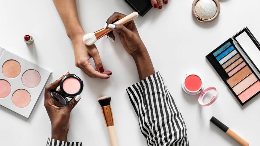 Beauty blogger testing cosmetics.