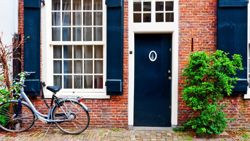 Bike in Front of a Brick Facade of the Old Dutch House - Image.