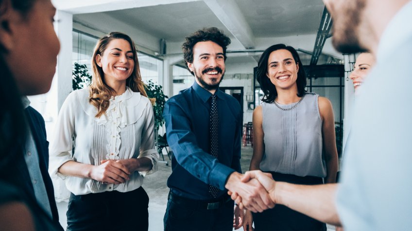 Business people shaking hands.