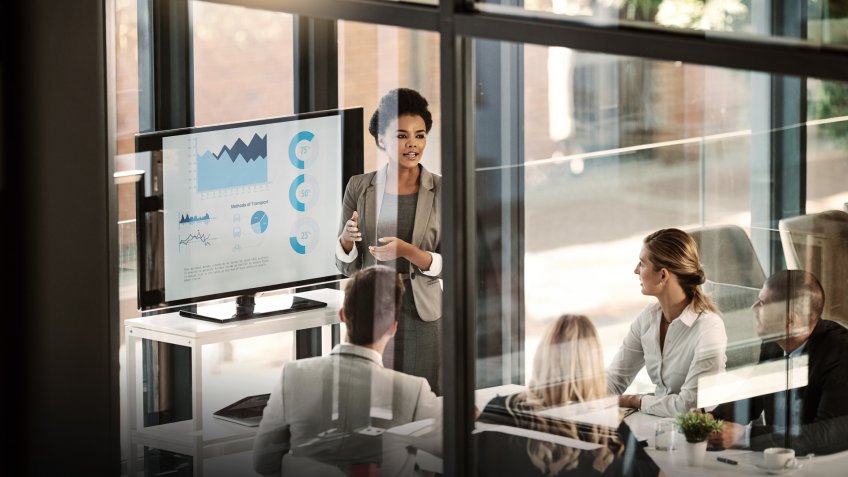 Shot of a businesswoman delivering a presentation to her colleagues in the boardroom.