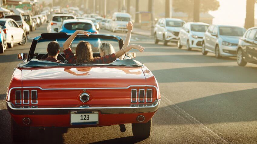 Shot of happy young friends enjoying a summer’s road trip together.
