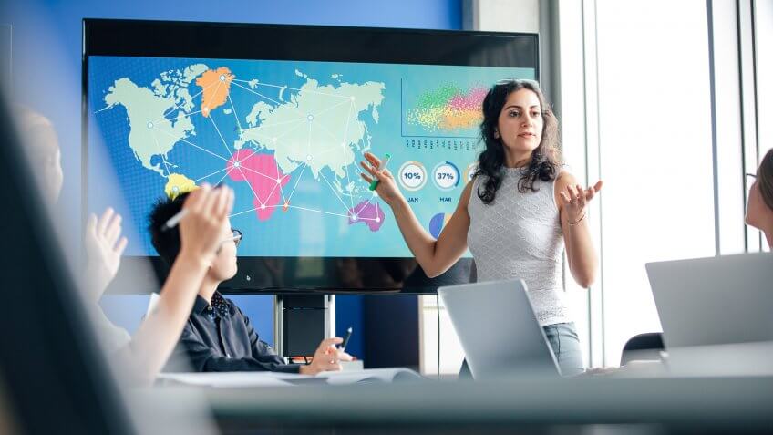 A mixed race woman is giving presentation.
