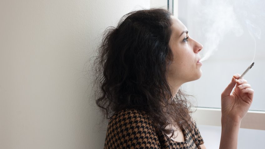 girl smoking inside