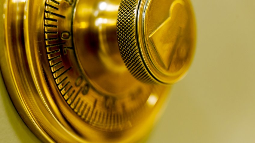Combination safe lock, in golden duotone.
