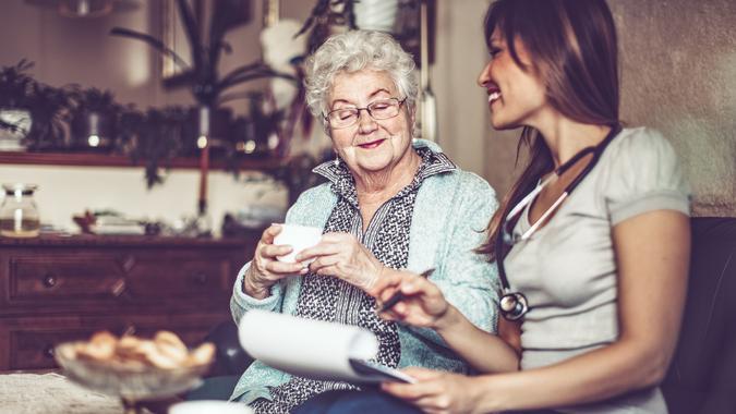 Social worker is visiting a senior woman in her own apartment.