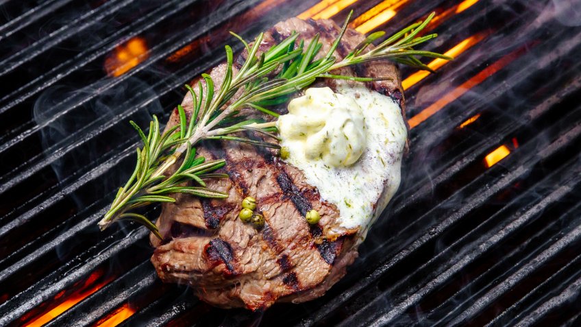 steak cooking on fire - Image.