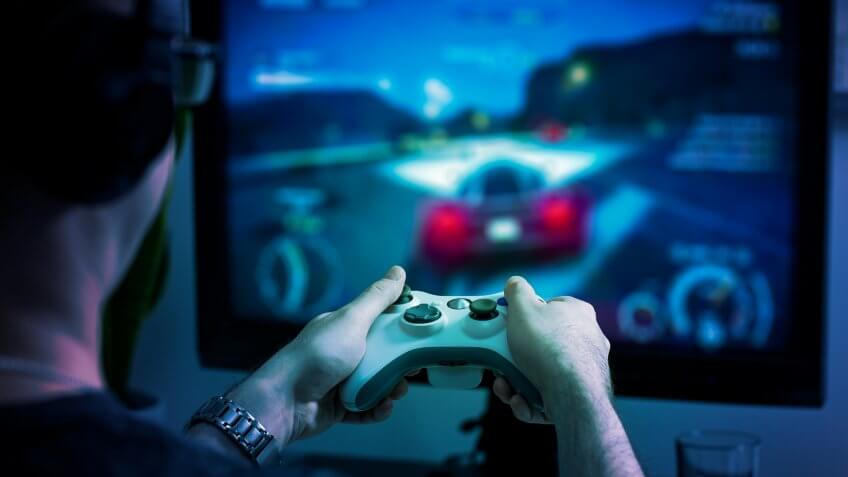 guy playing on gaming console