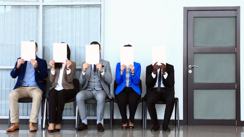 Human resource concept, Young businessman holding white billboard and waiting for job interview.