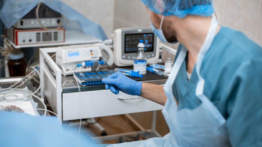 male anesthesiologist in operating room