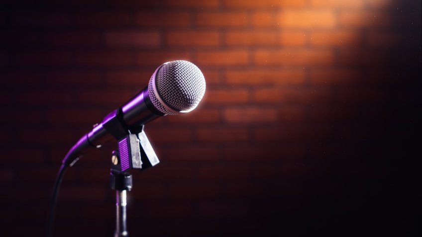 microphone on a stand up comedy stage with reflectors ray, high contrast image - Image.