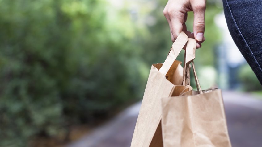 Girl doing ecological shopping with paper bags in hand - Image.