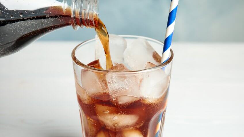 pouring a cola soda