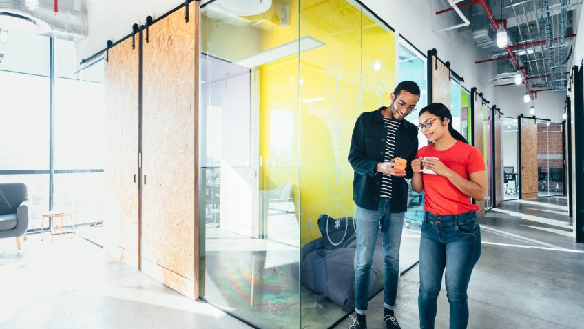 Young professionals meeting in co-working office.