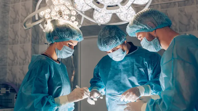surgeons working on patient