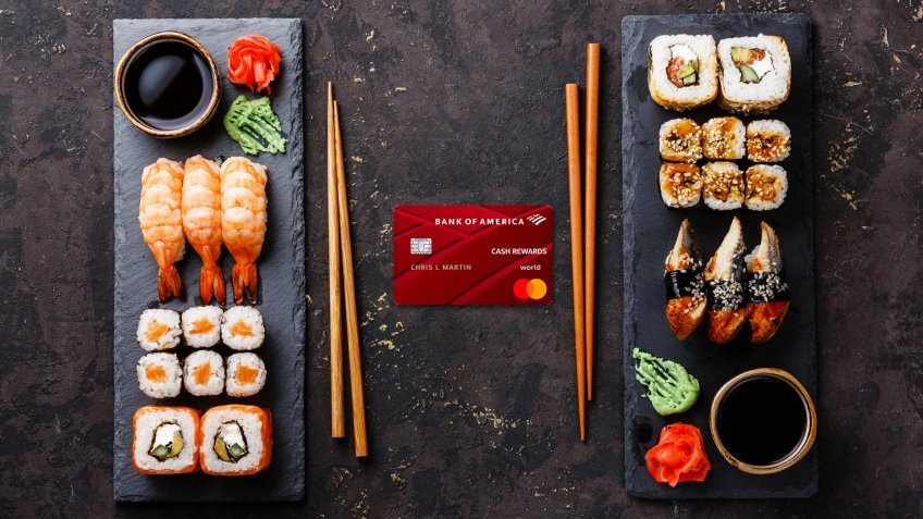 Sushi rolls, maki, nigiri Set served for two on black stone slate on dark background - Image.