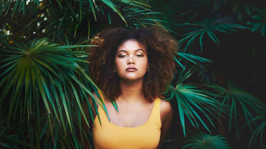 Portrait of a beautiful young woman posing in nature.