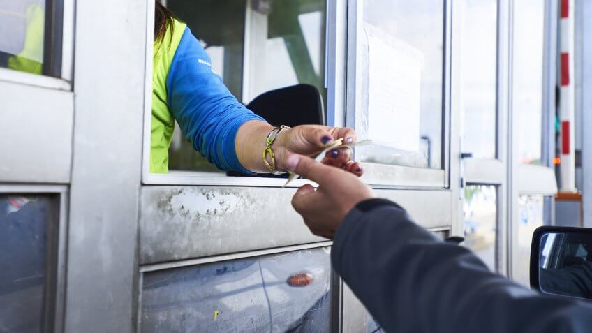 toll booth collector receiving money