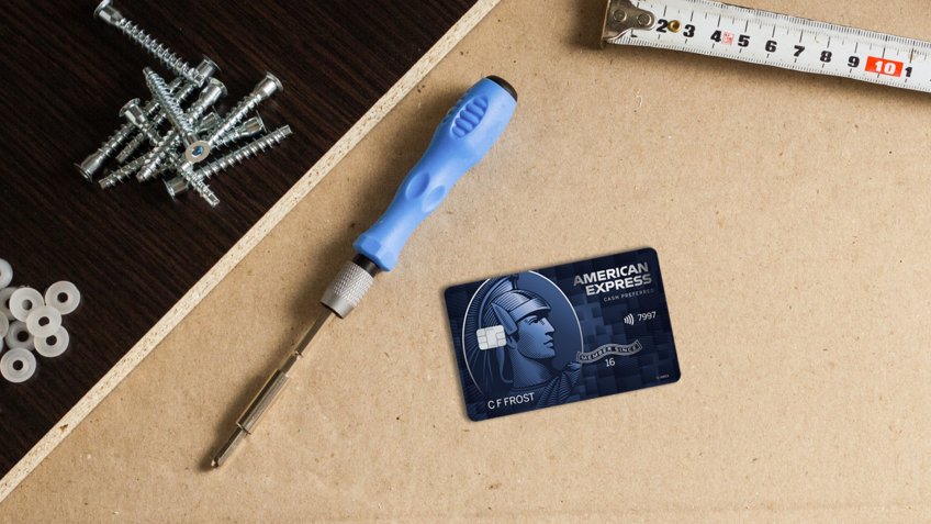 Tools, Furniture parts, Wrapping film, Screws on a sheet of cardboard.