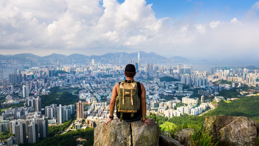 Man enjoying the Hong Kong view from the Lion rock.
