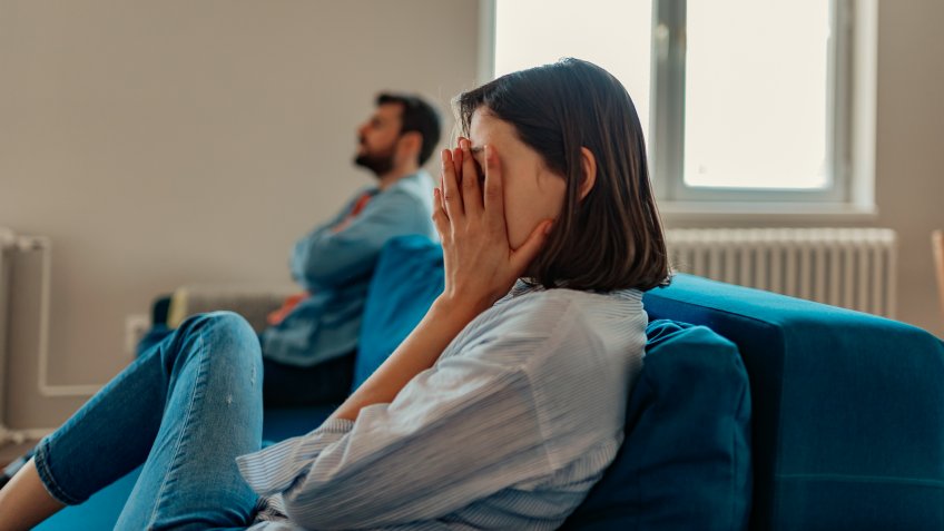 Unhappy Couple After an Argument in the Living Room at Home.